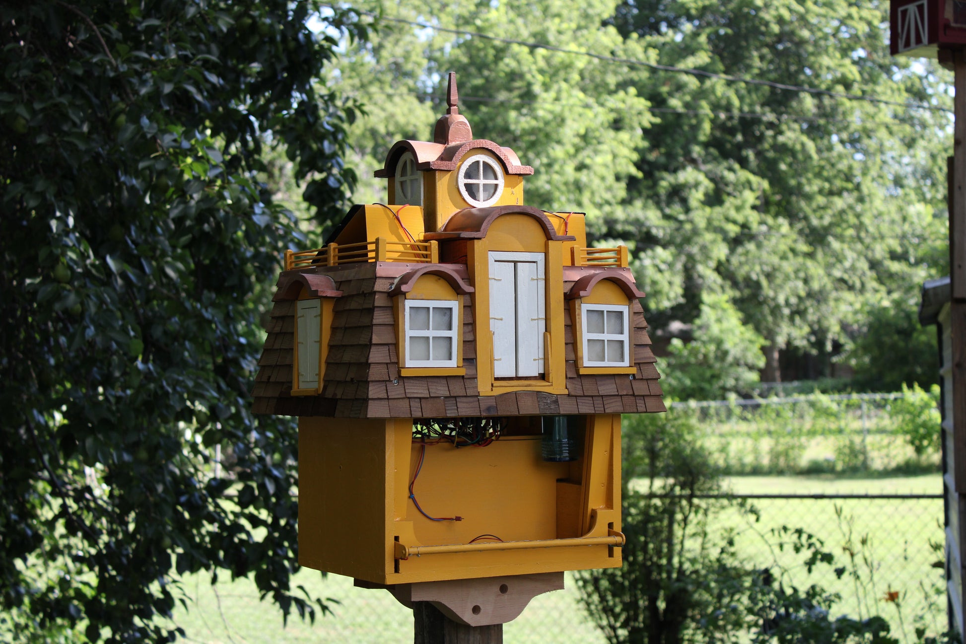 victorian style bird feeder with bright night lighting and squirrel repellant tech 